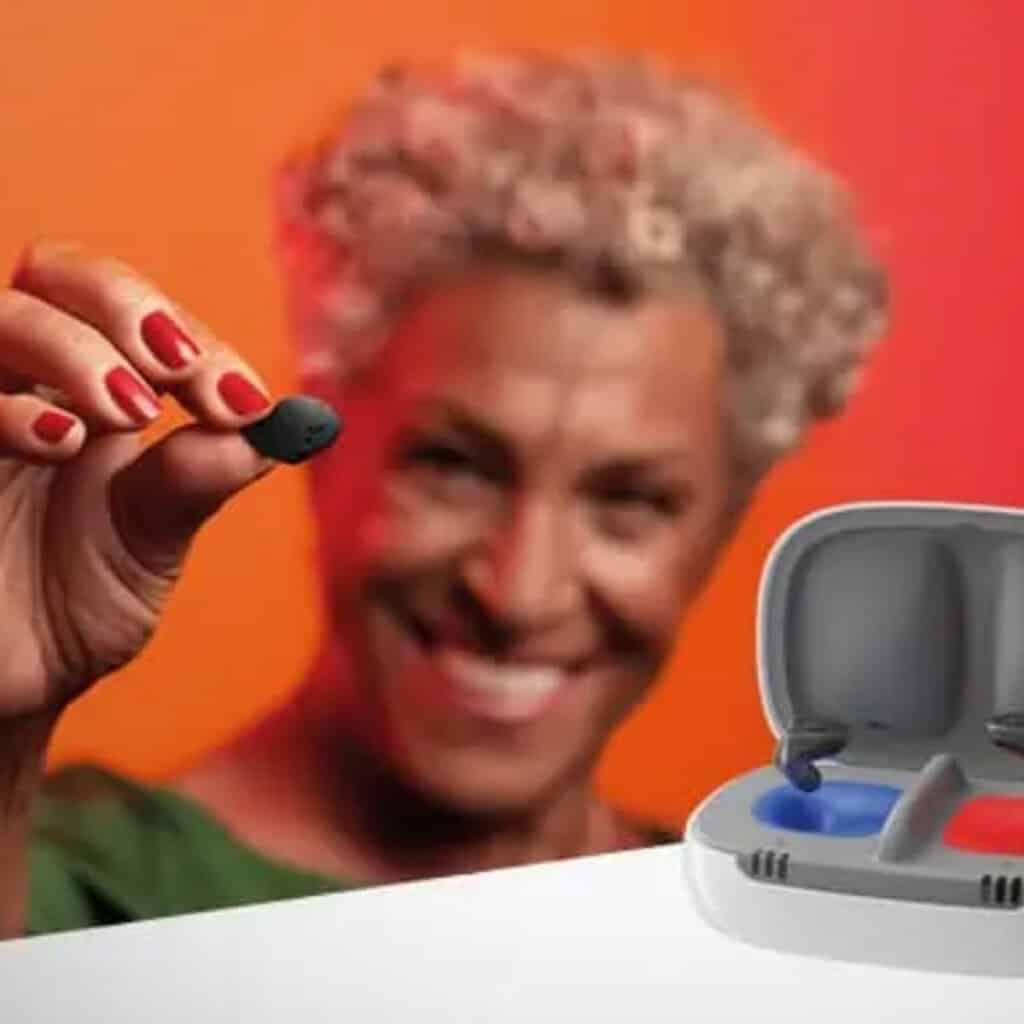 Invisible digital hearing aid in use